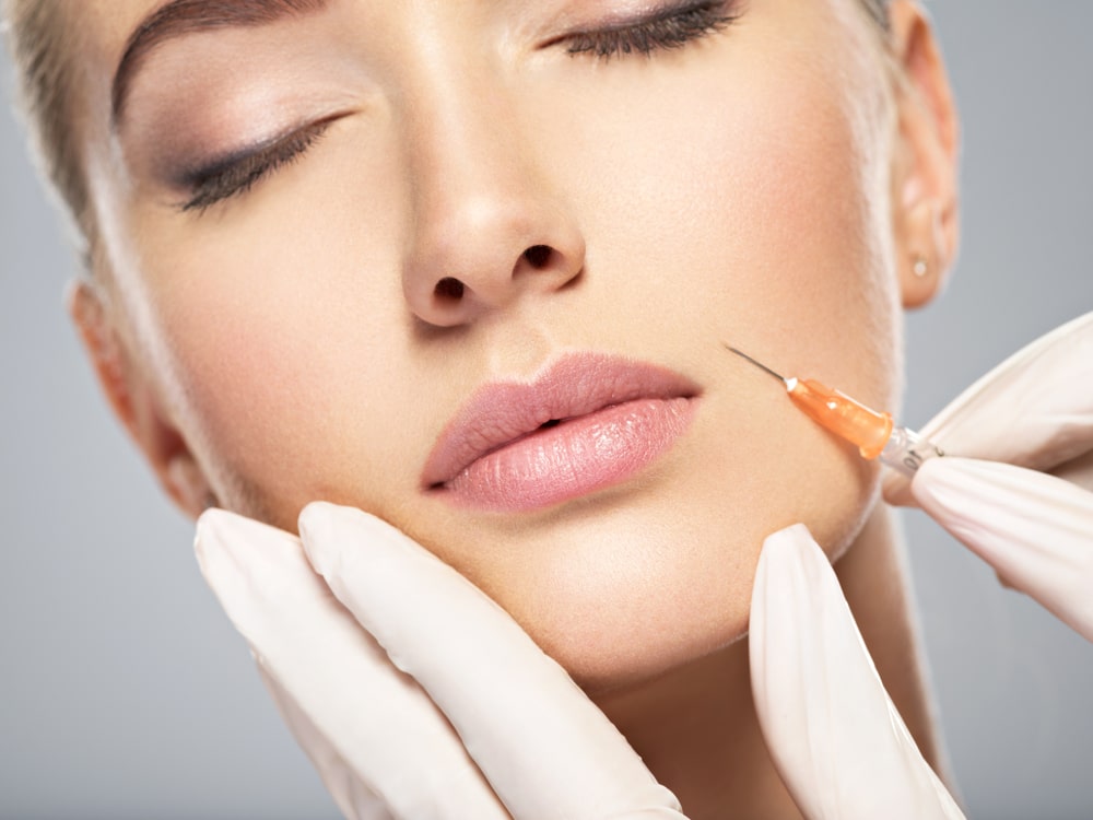 Woman,Getting,Cosmetic,Injection,Of,Botox,In,Cheek,,Closeup.,Woman